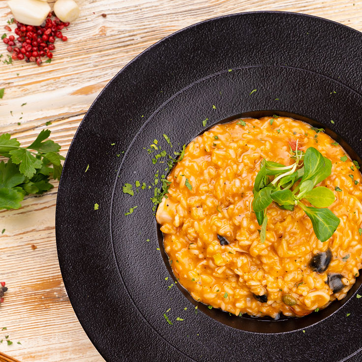 Risotto with squids, olives and spinach